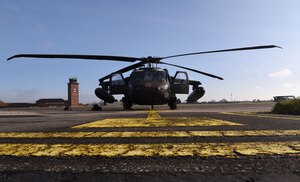 A U.S. Army UH-60M Black Hawk from the 1st Battalion, 214th Aviation Regiment (General Support Aviation Battalion), Weisbaden, Germany, sits on the flightline as its maintainers and aircrew prep it for takeoff at Royal Air Force Mildenhall, England, March 15, 2023. The helicopters stopped off for refueling and rest before heading to RAF Leeming, Scotland. (U.S. Air Force photo by Karen Abeyasekere)