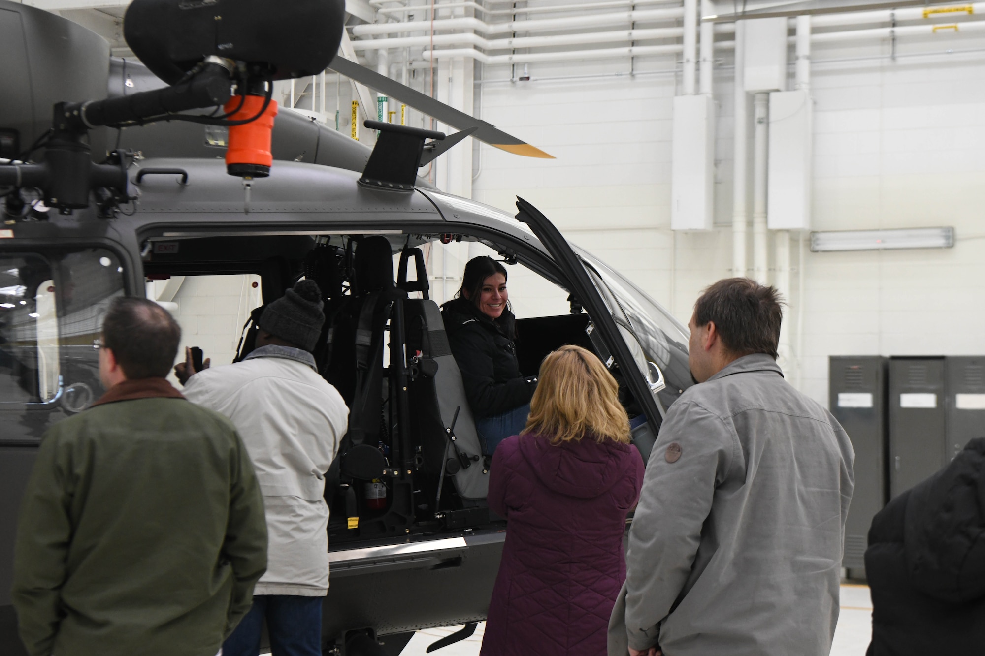 Woman sits in helicopter