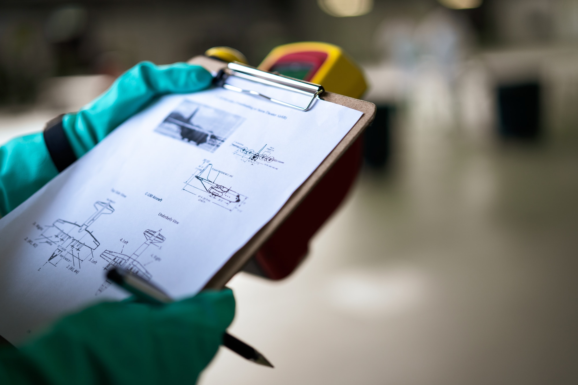 U.S. Air Force Airman 1st Class Bayley Straub, 786th Civil Engineer Squadron emergency management journeyman, reviews schematics in preparation for radiological contamination detection during exercise Radiant Falcon at Ramstein Air Base, Germany, March 16, 2023.