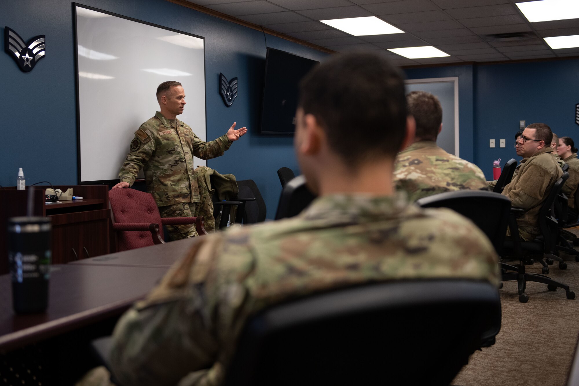 Chief speaks in front of airmen.