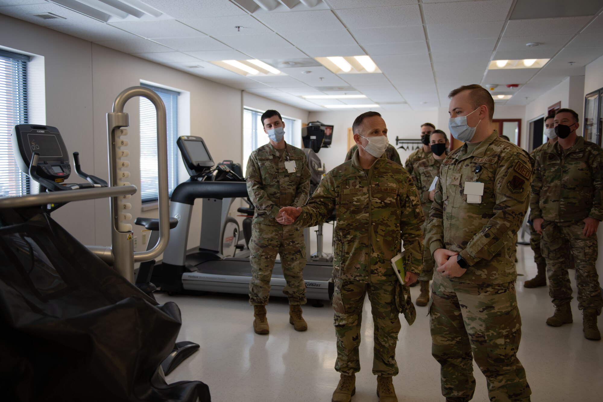 Airmen look at medical equipment.