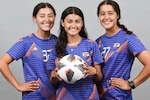 From left, Micki, Molly and Mary Kate Huynh, cadets at the Coast Guard Academy, pose for a group portrait in their soccer uniforms, here, Aug. 8, 2022. The teammates are also sisters in various years of cadet training. (U.S. Coast Guard courtesy photo by Bradley E. Clift)