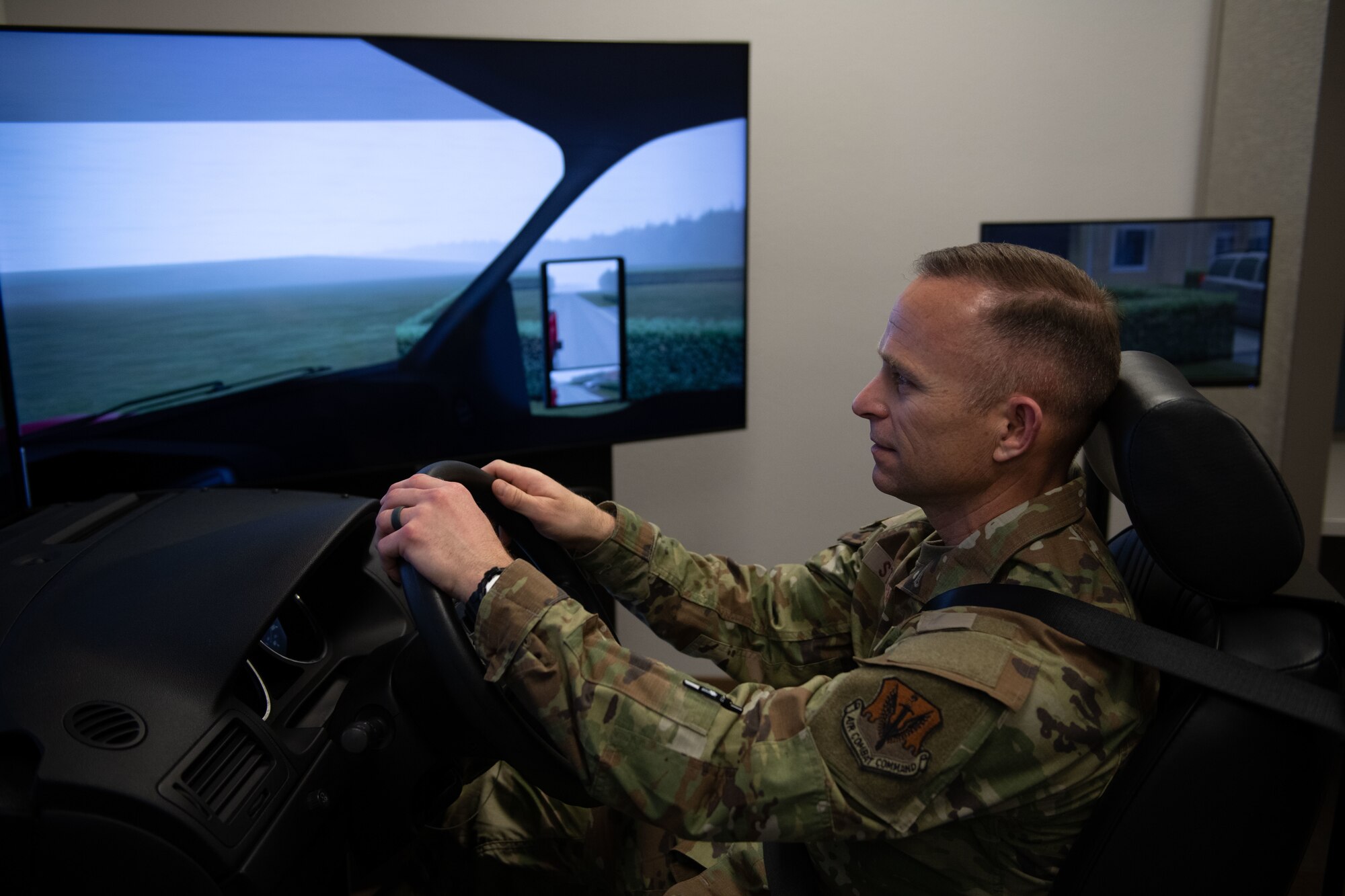 Chief drives car simulator.