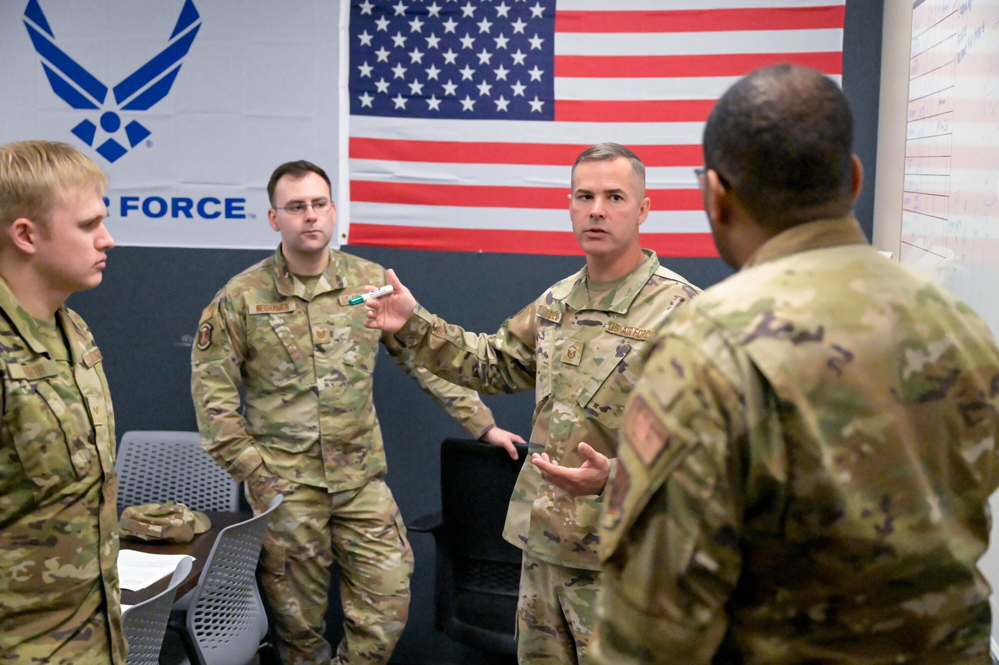 a man briefs other on proper procedures