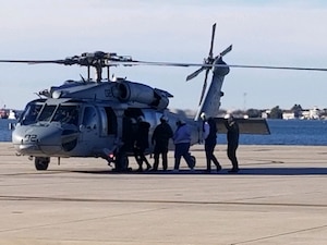 Rep. Jennifer Kiggans (R-Va.), Rep. Brad Finstad (R-Minn.) and members of their staff board an MH-60S attached to Helicopter Sea Combat Squadron (HSC) 2 for a familiarization flight during Meet the Fleet, Feb. 13. The Navy Office of Legislative Affairs executes Meet the Fleet to educate new Members of Congress on Navy operations and provide them a unique opportunity to visit bases to observe platforms and speak with Sailors.