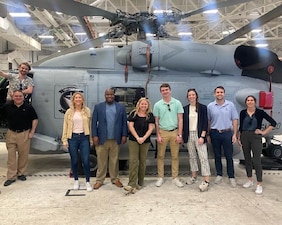 Eight congressional defense policy staff members view an MH-60R Seahawk attached to Helicopter Maritime Strike (HSM) 50 aboard Naval Station Mayport, Mar. 17. The Navy Office of Legislative Affairs executes Staff Delegations to provide congressional staff members a unique opportunity to see naval operations and to interact with Sailors throughout the Fleet.