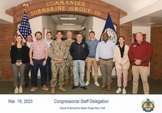 Congressional defense policy staff members meet with Rear Adm. TR Buchanan, Commander, Submarine Group TEN for a briefing on operations and a tour of Naval Submarine Base Kings Bay including Trident Training Facility, Trident Refit Facility, and USS ALASKA (SSBN 732) during a Staff Delegation (STAFFDEL), Mar. 18. The Navy Office of Legislative Affairs executes STAFFDELs to provide congressional staff members a unique opportunity to see naval operations and to interact with Sailors throughout the Fleet.