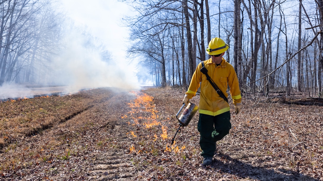 Mark Blake, Quantico Fire & Emergency Services, conducts controlled burns at Marine Corps Base Quantico, Virginia, March 9, 2023. According to the NREA, the purpose of the burns is to reduce fuel litter, minimize the potential of wildfires, and promote wildlife habitat. Fuel litter is dead and trodden woody debris that could be used as fuel for wildfires or other potential hazards.



In addition, excess foliage can disrupt the natural flow of nutrients throughout the soil and ecosystem as a whole. The burns are carried out multiple times throughout the year to achieve maximum results. Other benefits of conducting the controlled burns include the mitigation of pests and diseases, native plant reduction, and control of invasive species.