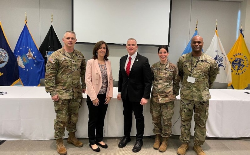 Left to right: COL Clark, Ms. Nicole Kilgore and Mr. Darryl Colvin, MAJ Sarah Sanjakdar and LTC Owen Roberts II standing side by side.