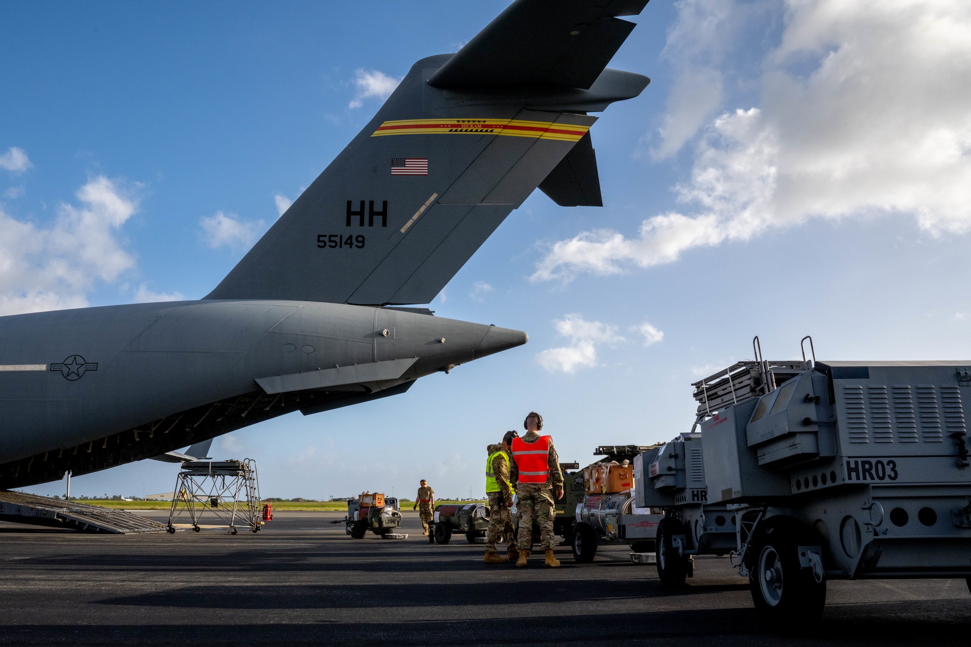 Airmen assigned to the 535th Airlift Squadron and the 735th Air Mobility Squadron load cargo on a C-17 Globemaster III at Joint Base Pearl Harbor-Hickam, Hawaii, during the Joint Base Readiness Exercise, March 1, 2023. The 15th Wing trains to operate, fight and advance its capabilities through realistic training exercises designed to test and develop joint logistics, resilience and rapid strategic mobility. (U.S. Air Force photo by Senior Airman Makensie Cooper)