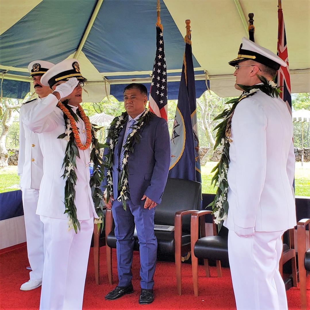 JOINT BASE PEARL HARBOR-HICKAM, HI (March 17, 2023) Capt. Stephen Padhi, commanding officer, Officer in Charge of Construction Pearl Harbor Naval Shipyard (OICC PHNSY), salutes NAVFAC Pacific Commander Rear Adm. Jeff Kilian as Padhi assumes command March 17, 2023. The OICC team of more than 140 people will provide on-site construction oversight, accountability, technical and contracting authority over a once-in-a-generation recapitalization of PHNSY, including the historic $2.8-billion replacement of Dry Dock 3. (U.S. Navy photo by Bill Couch)