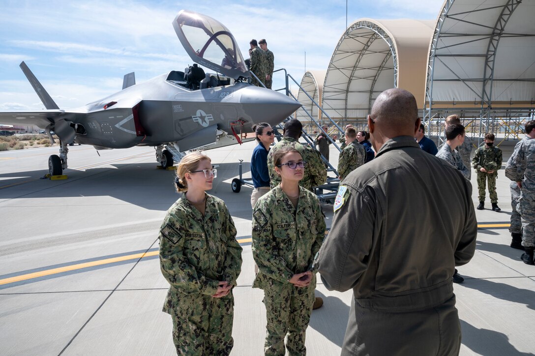 Civil Air Patrol and United States Naval sea cadets listen to Air Force Operational Test and Evaluation Center Detachment 5 leadership speak about the Navy VX-9 F-35C during a tour of Edwards Air Force Base, March 17.