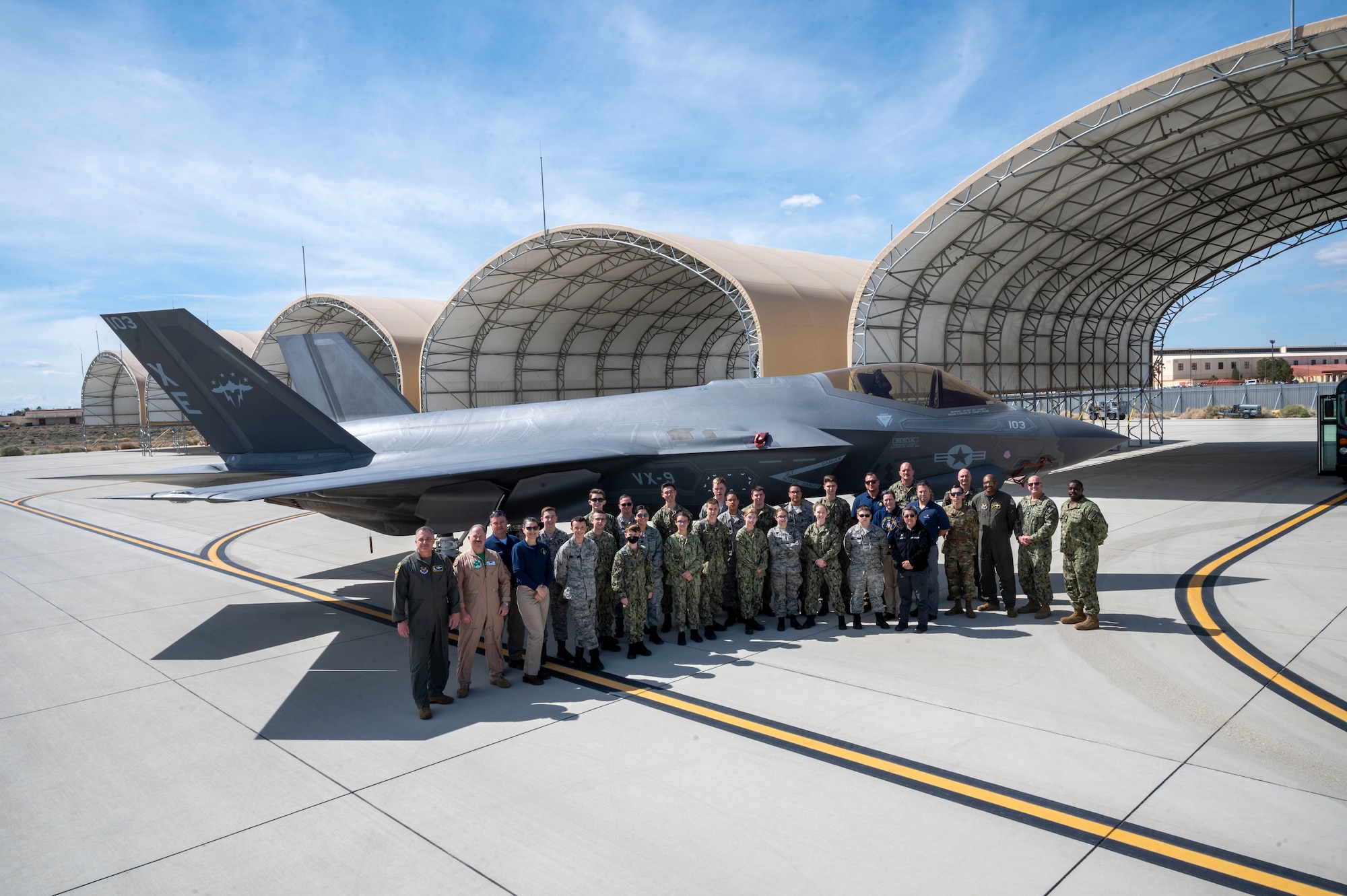 Civil Air Patrol and United States Naval sea cadets pose for a photo in front of a Navy VX-9 F-35C during a tour of Edwards Air Force Base hosted by the Air Force Operational Test and Evaluation Center Detachment 5, March 17.