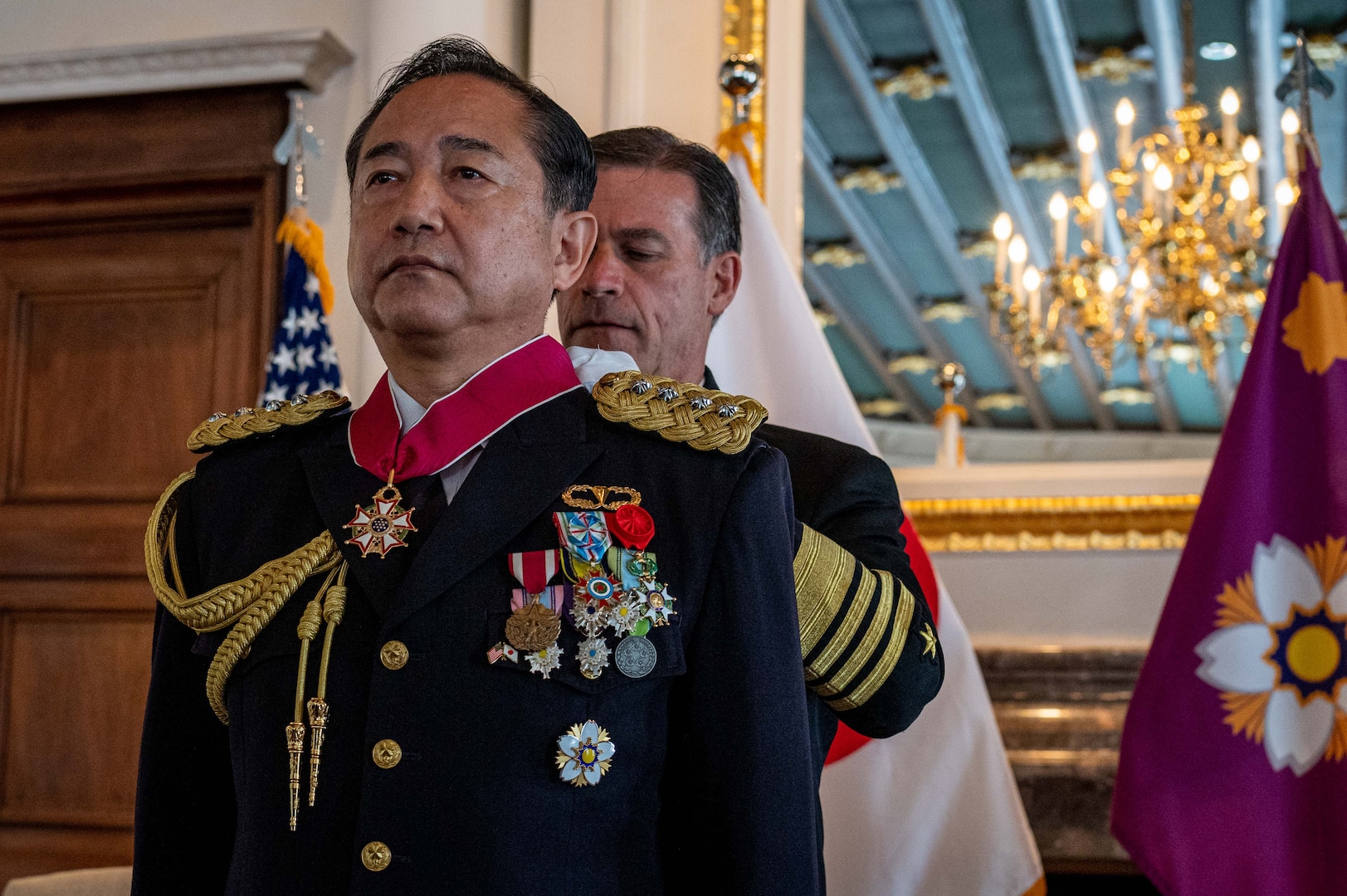 TOKYO (March 19, 2023) Gen. Kōji Yamazaki, Chief of Staff, Joint Staff of the Japan Self-Defense Forces, receives the Legion of Merit medal pinned by Adm. John C. Aquilino, Commander U.S. Indo-Pacific Command, in Tokyo. Yamazaki received the award for exceptionally meritorious service, where his professionalism, initiative and dedication to duty resulted in significant advancements in the United States-Japan mutual security partnership, expansions to the Self-Defense Forces contributions regionally and globally, updates to force posture and continuous bilateral information exchange. (U.S. Navy photo by Chief Mass Communication Specialist Shannon M. Smith)