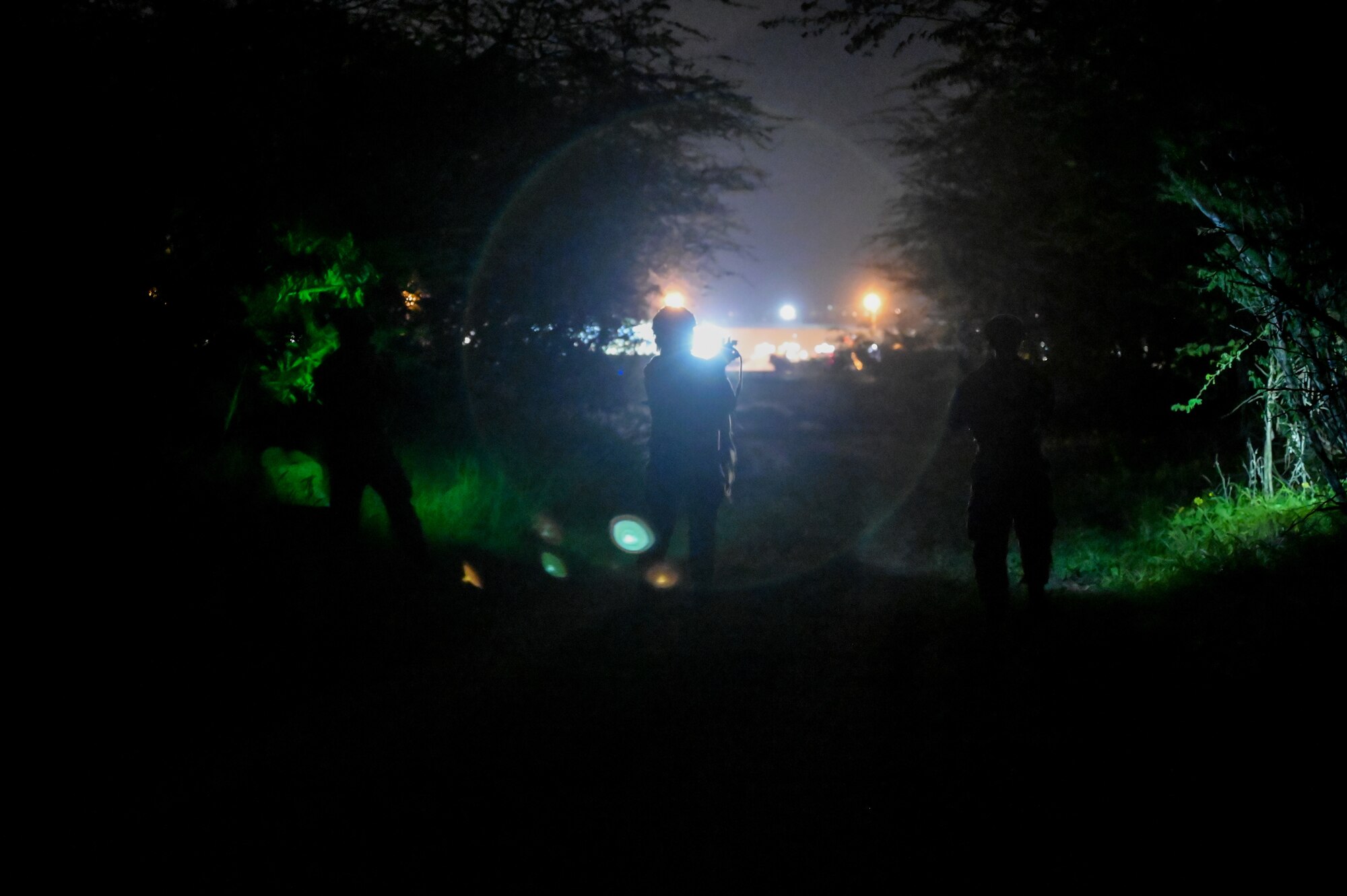 Airmen assigned to the 647th Security Forces Squadron patrol Base X during a Joint Base Readiness Exercise at Joint Base Pearl Harbor-Hickam, Hawaii, March. 7, 2023. JBRE is the largest exercise the 15th Wing has executed in over a decade, including over eight other participating units throughout the Pacific. (U.S. Air Force photo by Staff Sgt. Alan Ricker)