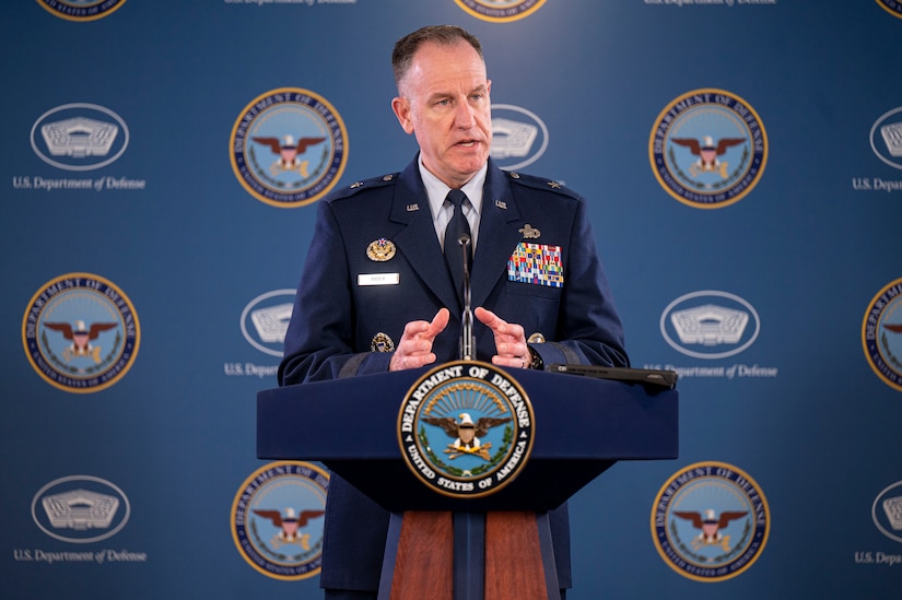 A man speaks from a podium.