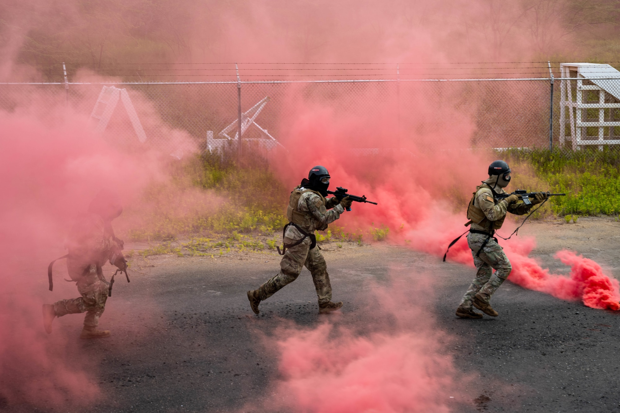 Members of the 647th Security Forces Squadron entered and cleared MOUNT village, a simulated urban training structure, during Joint Base Readiness Exercise 23-01 at Joint Base Pearl Harbor-Hickam, Hawaii, March 8, 2023. The 15th Wing trains to operate, fight and advance its capabilities through realistic training exercises designed to test and develop joint logistics, resilience and rapid strategic mobility. (U.S. Air Force photo by SrA Makensie Cooper)
