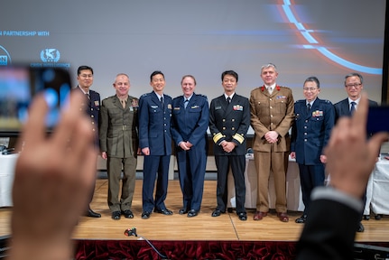 Brig. Gen. James Wellons, deputy commander of U.S. Forces Japan, stands with military officers from each service of Japan’s Self Defense Forces as well as senior officers from the British Army and Royal Australian Air Force, after a panel at the Defense Security Equipment International conference in Tokyo, Japan, Friday, March 17. The panel discussed the important role of logistics planning to national security strategy.