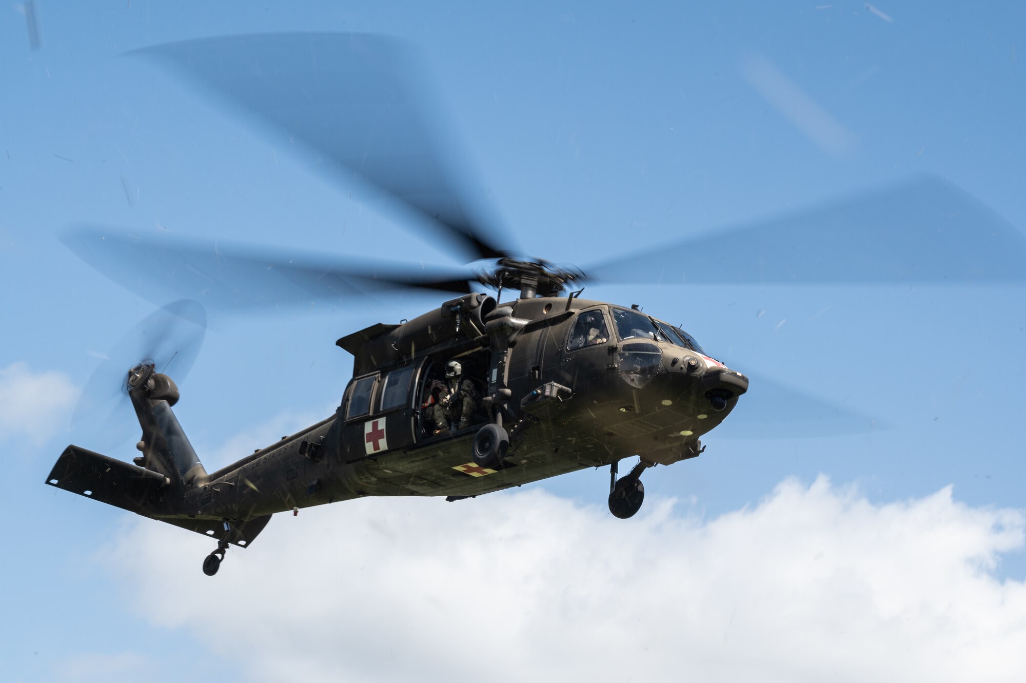 A HH-60 Black Hawk assigned to the 25th Combat Aviation Brigade transports volunteer patients with simulated injuries during a Joint Base Readiness Exercise at Joint Base Pearl Harbor-Hickam, Hawaii, Mar. 8, 2023. The 15th Wing trains to operate, fight and advance its capabilities through realistic training exercises designed to test and develop joint logistics, resilience and rapid strategic mobility. (U.S. Air Force photo by Staff Sgt. Alan Ricker)