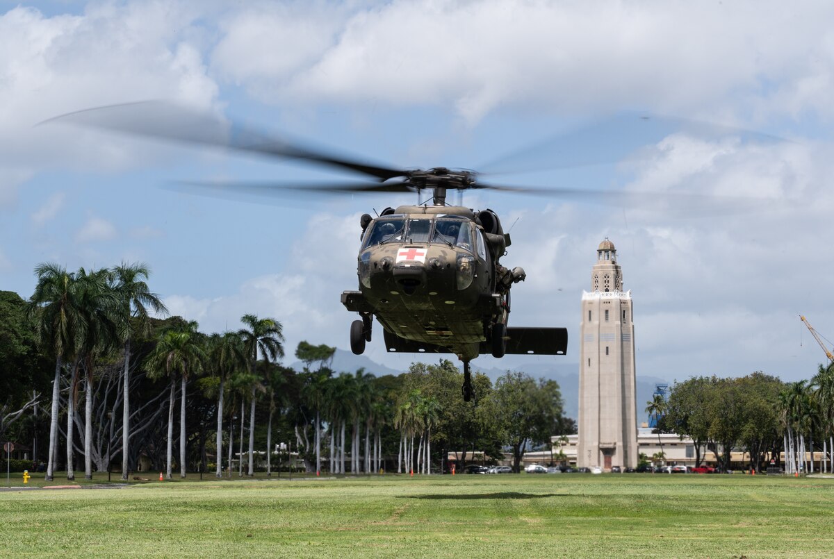 Soldiers assigned to the 25th Combat Aviation Brigade land an HH-60 Black Hawk near the 15th Medical Group to transport volunteers with simulated injuries during a Joint Base Readiness Exercise at Joint Base Pearl Harbor-Hickam, Hawaii, Mar. 8, 2023. Team Hickam trains to operate, fight, and advance its capabilities through realistic training exercises designed to test and develop joint logistics, resilience and rapid strategic mobility. (U.S. Air Force photo by Staff Sgt. Alan Ricker)