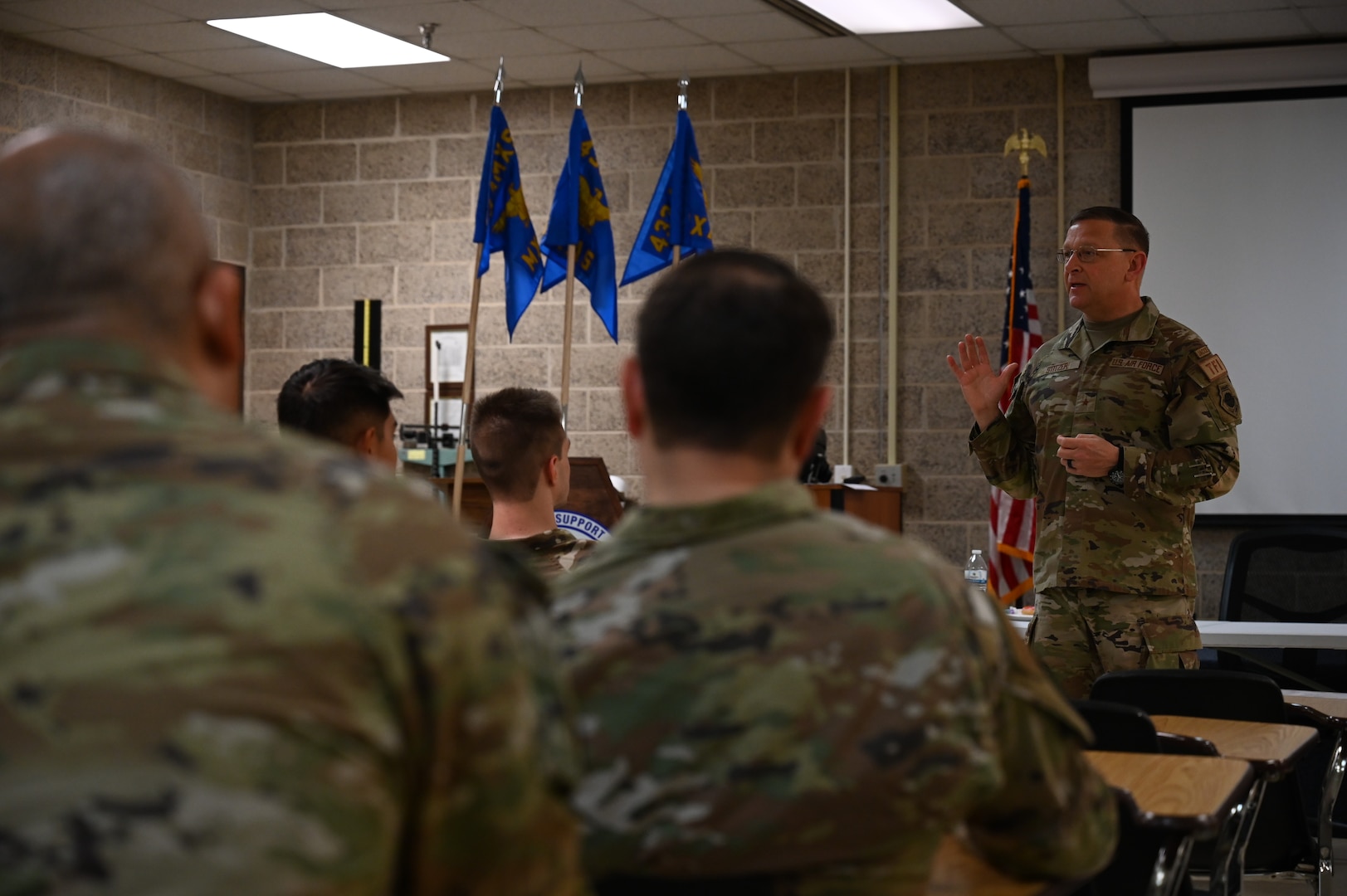 Brig. Gen. Max Stitzer, mobilization assistant to Headquarters Air Force Director of Staff, speaks to several airmen and their supervisors from the 433rd Maintenance Group during his visit to the 433rd Airlift Wing at Joint Base San Antonio-Lackland, Texas, March 5, 2023.