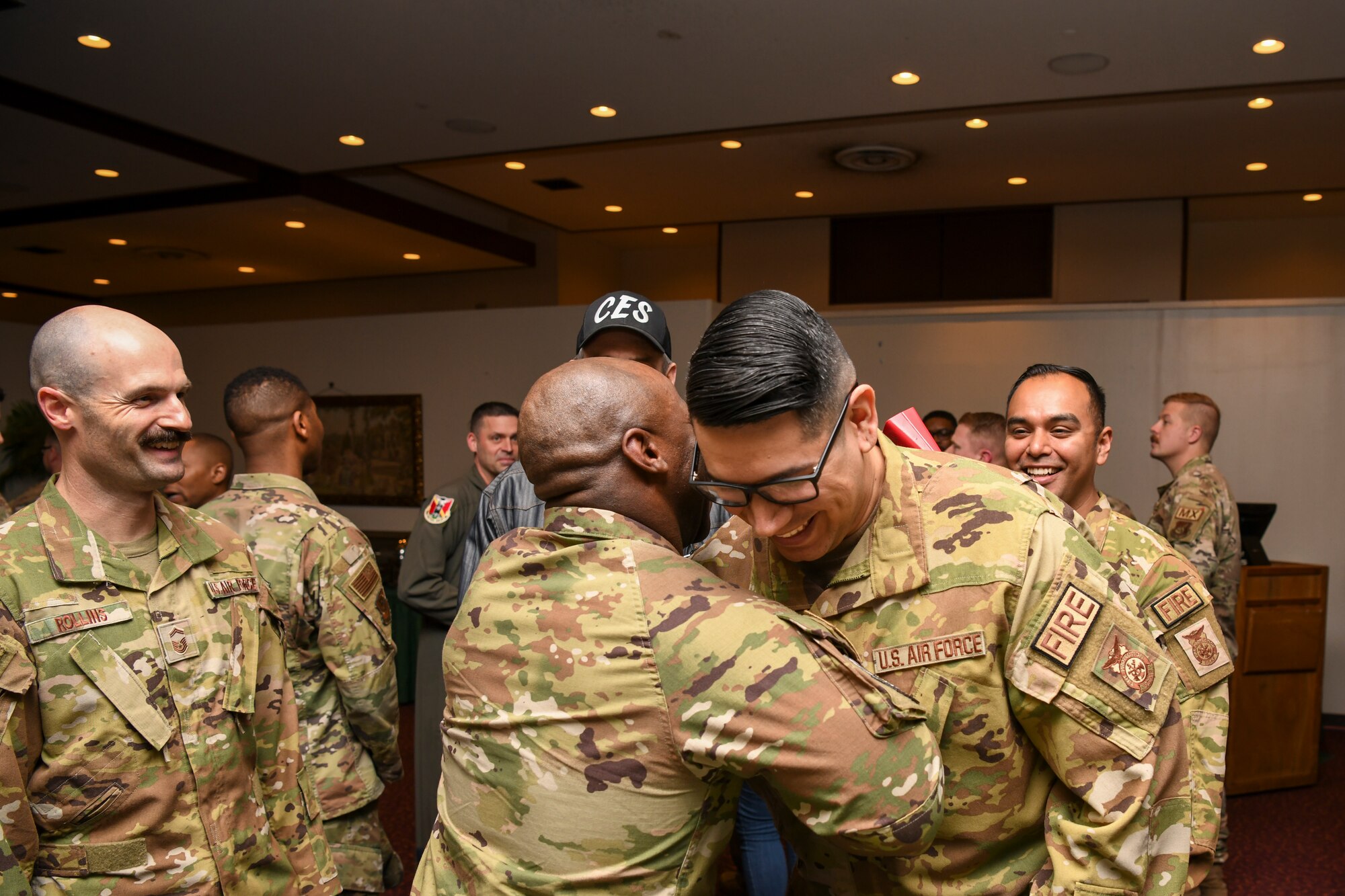 U.S. Air Force Master Sgt. John Valdez, 374th Civil Engineering Squadron assistant chief of operations, shakes hands with Chief Master Sgt. Patrick Holmes, 374th CES senior enlisted leader, during a senior master sergeant release party at Yokota Air Base, Japan, March 17, 2023. Air Force officials selected 1,629 master sergeants for promotion to senior master sergeant, out of 16,031 eligible, for a selection rate of 10.16 percent in the 23E8 promotion cycle. (U.S. Air Force photo by Senior Airman Spencer Tobler)