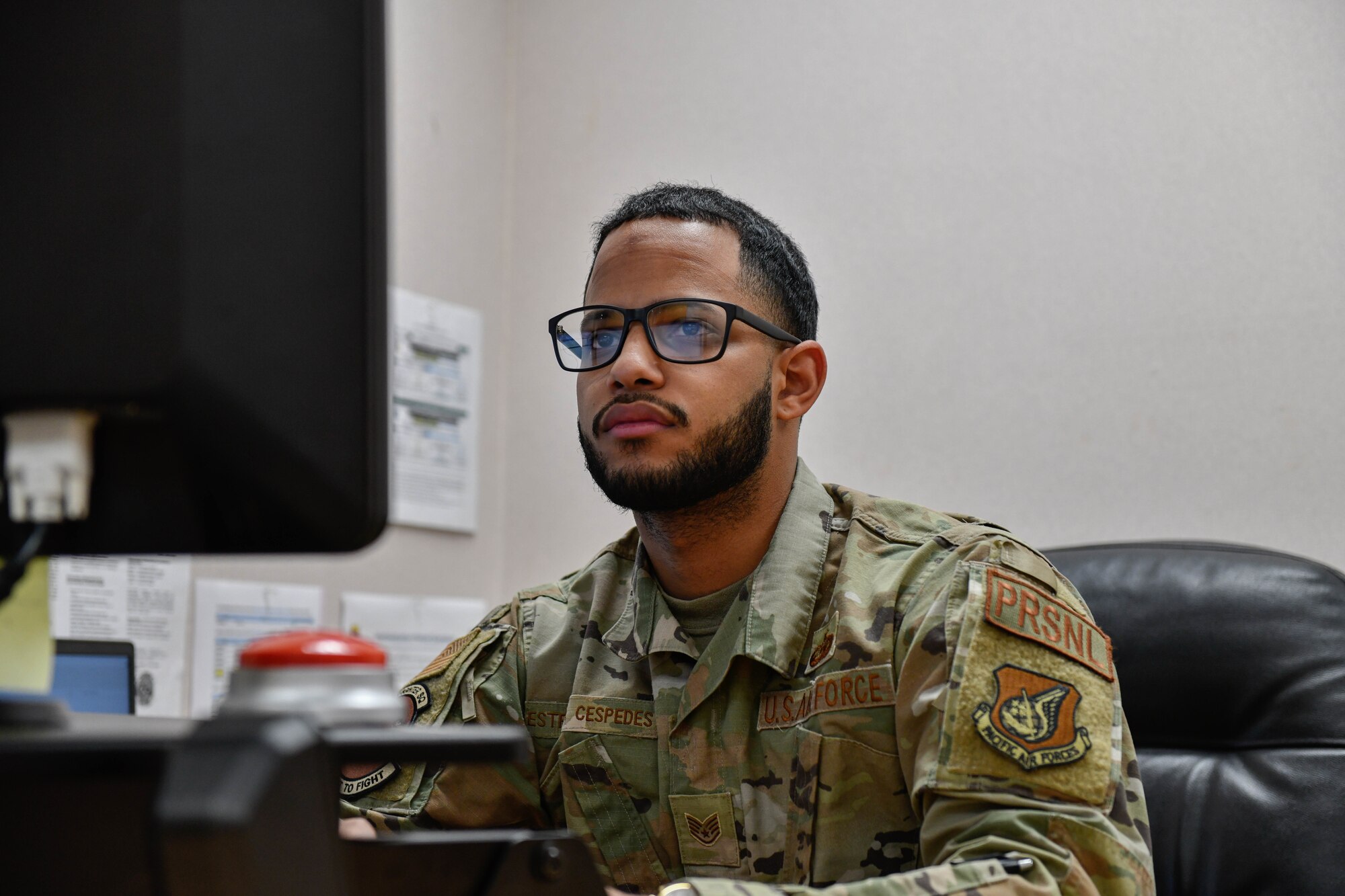 man works on computer