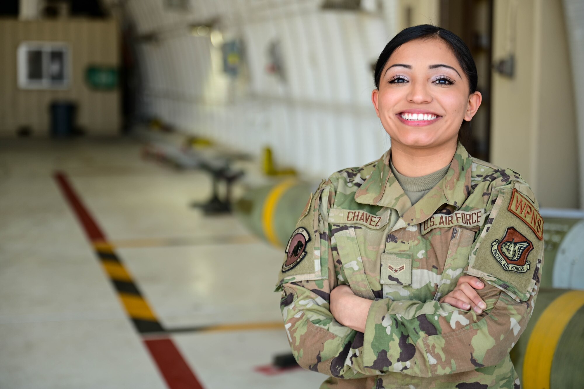 Airman 1st Class Katelyn Chavez, 8th Maintenance Squadron weapons load team member, smiles for a portrait at Kunsan Air Base, Republic of Korea, Mar. 21, 2023.