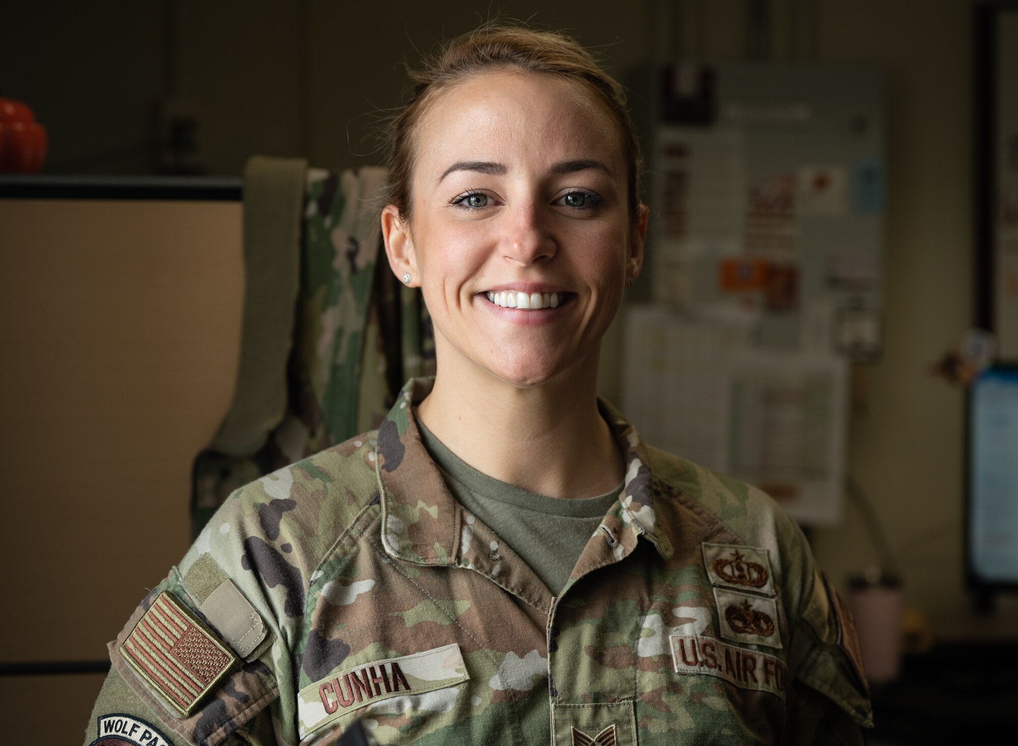 Tech. Sgt. Tiffany Cunha, 8th Fighter Wing command chief executive assistant, smiles for a portrait at Kunsan Air Base, Republic of Korea, Mar. 16, 2023.