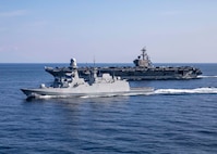 (March 5, 2023) The Carlo Bergamini-class frigate ITS Virginio Fasan (F 591) and the Nimitz-class aircraft carrier USS George H.W. Bush (CVN 77) transit the Mediterranean Sea, March 5, 2023. The George H.W. Bush CSG is on a scheduled deployment in the U.S. Naval Forces Europe area of operations, employed by U.S. Sixth Fleet to defend U.S., allied and partner interests.