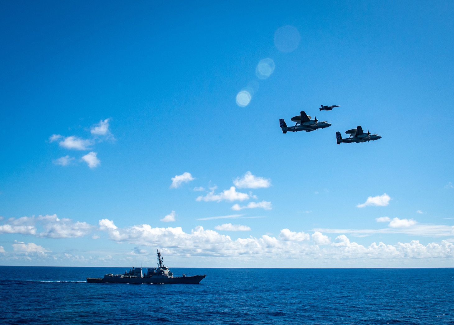 (March 17, 2023) Two E-2D Hawkeye aircraft and an F/A-18 Super Hornet Aircraft attached to Carrier Air Wing (CVW) 7, perform a flyover above the Arleigh Burke-class destroyer USS Delbert D. Black (DDG 119), during a change of command ceremony, March 17, 2023. During the ceremony Cmdr. Matthew Campbell relieved Cmdr. Robert Whitmore as commander, VAW-121. CVW-7 is the offensive air and strike component of Carrier Strike Group (CSG) 10 and the George H.W. Bush CSG. The squadrons of CVW-7 are Strike Fighter Squadron (VFA) 143, VFA-103, VFA-86, VFA-136, VAW-121, Electronic Attack Squadron (VAQ) 140, Helicopter Sea Combat Squadron (HSC) 5, and Helicopter Maritime Strike Squadron (HSM) 46. The George H.W. Bush CSG is on a scheduled deployment in the U.S. Naval Forces Europe area of operations, employed by U.S. Sixth Fleet to defend U.S., allied and partner interests.