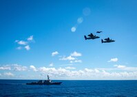 (March 17, 2023) Two E-2D Hawkeye aircraft and an F/A-18 Super Hornet Aircraft attached to Carrier Air Wing (CVW) 7, perform a flyover above the Arleigh Burke-class destroyer USS Delbert D. Black (DDG 119), during a change of command ceremony, March 17, 2023. During the ceremony Cmdr. Matthew Campbell relieved Cmdr. Robert Whitmore as commander, VAW-121. CVW-7 is the offensive air and strike component of Carrier Strike Group (CSG) 10 and the George H.W. Bush CSG. The squadrons of CVW-7 are Strike Fighter Squadron (VFA) 143, VFA-103, VFA-86, VFA-136, VAW-121, Electronic Attack Squadron (VAQ) 140, Helicopter Sea Combat Squadron (HSC) 5, and Helicopter Maritime Strike Squadron (HSM) 46. The George H.W. Bush CSG is on a scheduled deployment in the U.S. Naval Forces Europe area of operations, employed by U.S. Sixth Fleet to defend U.S., allied and partner interests.