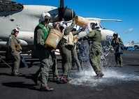 (March 17, 2023) Sailors assigned to Airborne Command and Control Squadron (VAW) 121 splash Cmdr. Robert Whitmore, commander, VAW-121, after a change of command ceremony, March 8, 2023. During the ceremony Cmdr. Matthew Campbell relieved Cmdr. Robert Whitmore as commander, VAW-121. Carrier Air Wing (CVW) 7 is the offensive air and strike component of Carrier Strike Group (CSG) 10 and the George H.W. Bush CSG. The squadrons of CVW-7 are Strike Fighter Squadron (VFA) 143, VFA-103, VFA-86, VFA-136, Electronic Attack Squadron (VAQ) 140, VAW-121, Helicopter Sea Combat Squadron (HSC) 5, and Helicopter Maritime Strike Squadron (HSM) 46. The George H.W. Bush CSG is on a scheduled deployment in the U.S. Naval Forces Europe area of operations, employed by U.S. Sixth Fleet to defend U.S., allied and partner interests.