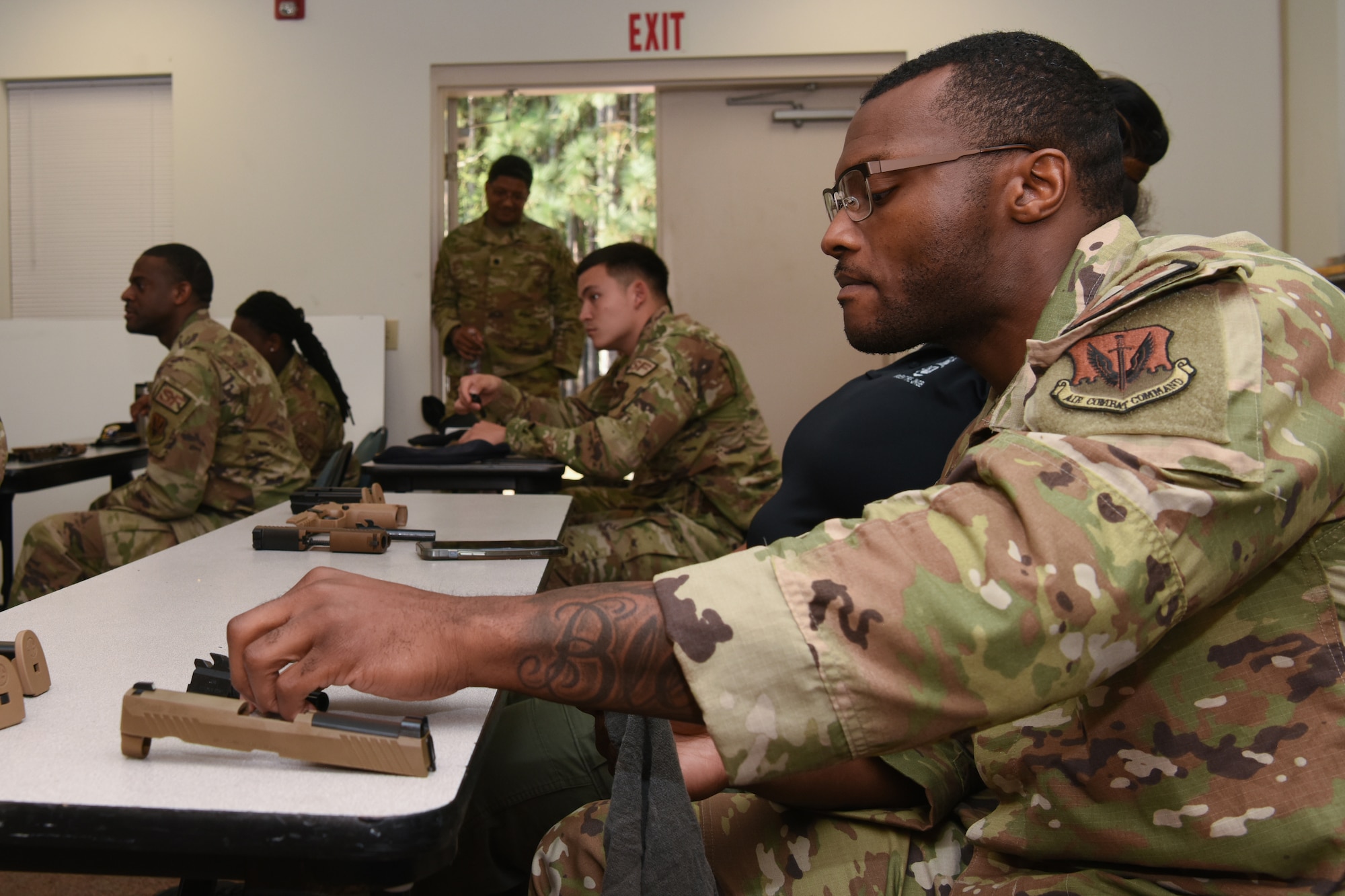 U.S. Air Force Airmen assigned to the 169th Security Forces Squadron engage in a safety brief for the M-18 pistol at McEntire Joint National Guard Base, South Carolina Air National Guard, March 7, 2023. The training equips Airmen with the necessary skills to operate a weapon efficiently in combative scenarios. (U.S. Air National Guard photo by Airman 1st Class Danielle Dawson)