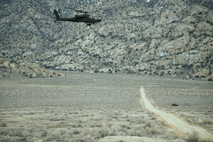 Brigadier General Charlene Dalto, land component commander, and Command Team observe a live-fire aerial gunnery training exercise with 1st Attack Battalion, 211th Aviation Regiment, at the Utah Test and Training Range by Barro, Utah, Mar. 14, 2023. This training event was in preparation for the Joint Readiness Training Center (JRTC), in Fort Polk, Louisiana. (U.S. Army National Guard Photo by Staff Sgt. Cambrin Bassett)