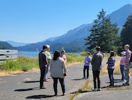 Environmental experts with the Environmental and Munitions Center of Expertise (EMCX) and other U.S. Army Corps of Engineers (USACE) entities conduct a site visit at Bradford Island, Oregon, on July 26. USACE has been working with the Oregon Department of Environmental Quality, U.S. Environmental Protection Agency and Washington Department of Ecology to evaluate and oversee cleanup of various contamination sources on the island and the adjoining Columbia River, which lies within the Bonneville Dam complex, since 1997. (Photo by Dave Becker)