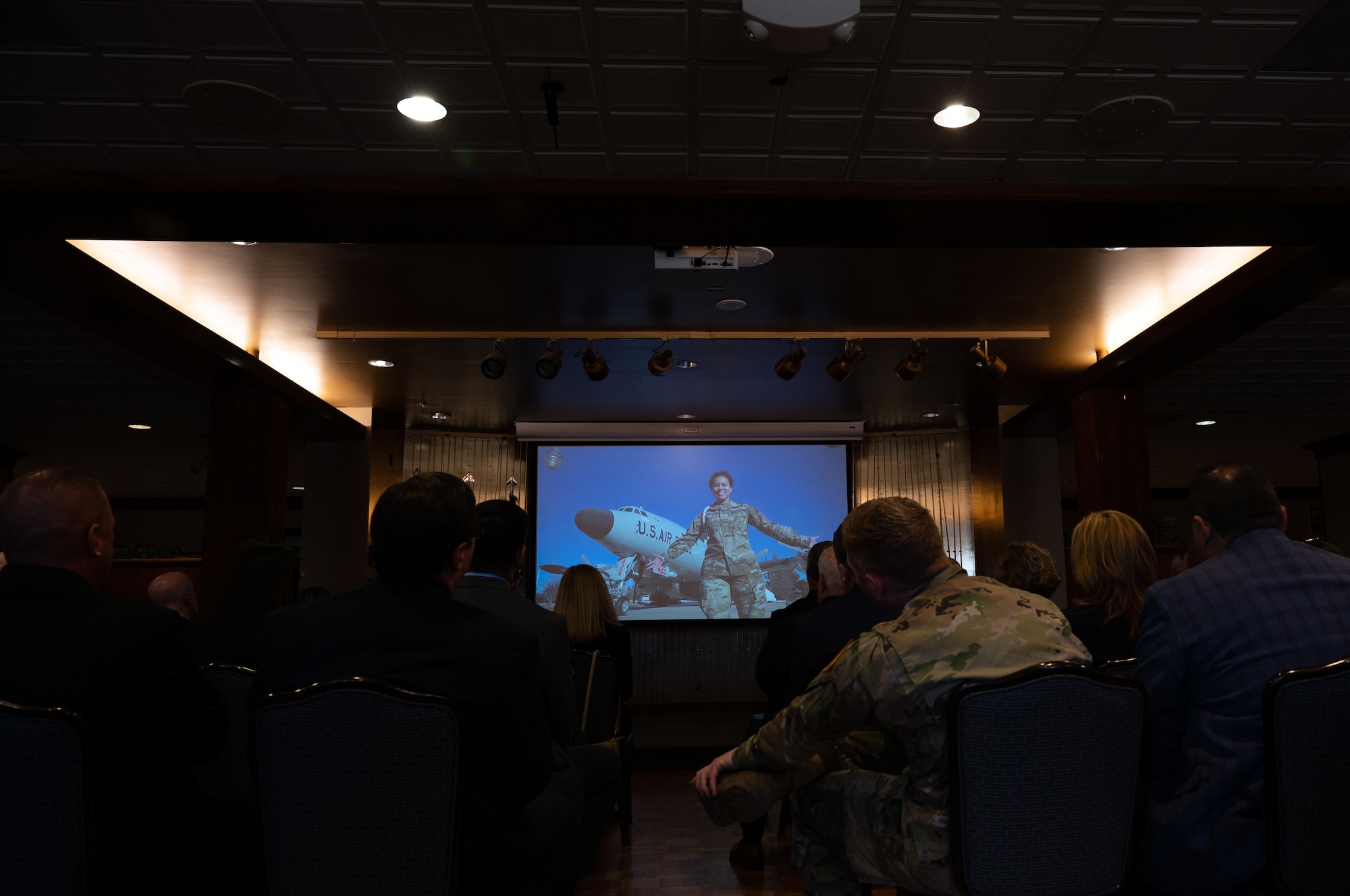 Space Base Delta 1 leadership and civic leaders watch the SBD 1 mission video before the State of the Bases address at Peterson Space Force Base, Colorado, March 22, 2023. The mission video showcases SBD 1's vision of being "One Team" and highlights its Airmen, Guardians and civilians. (U.S. Space Force photo by SrA Jared Bunn)