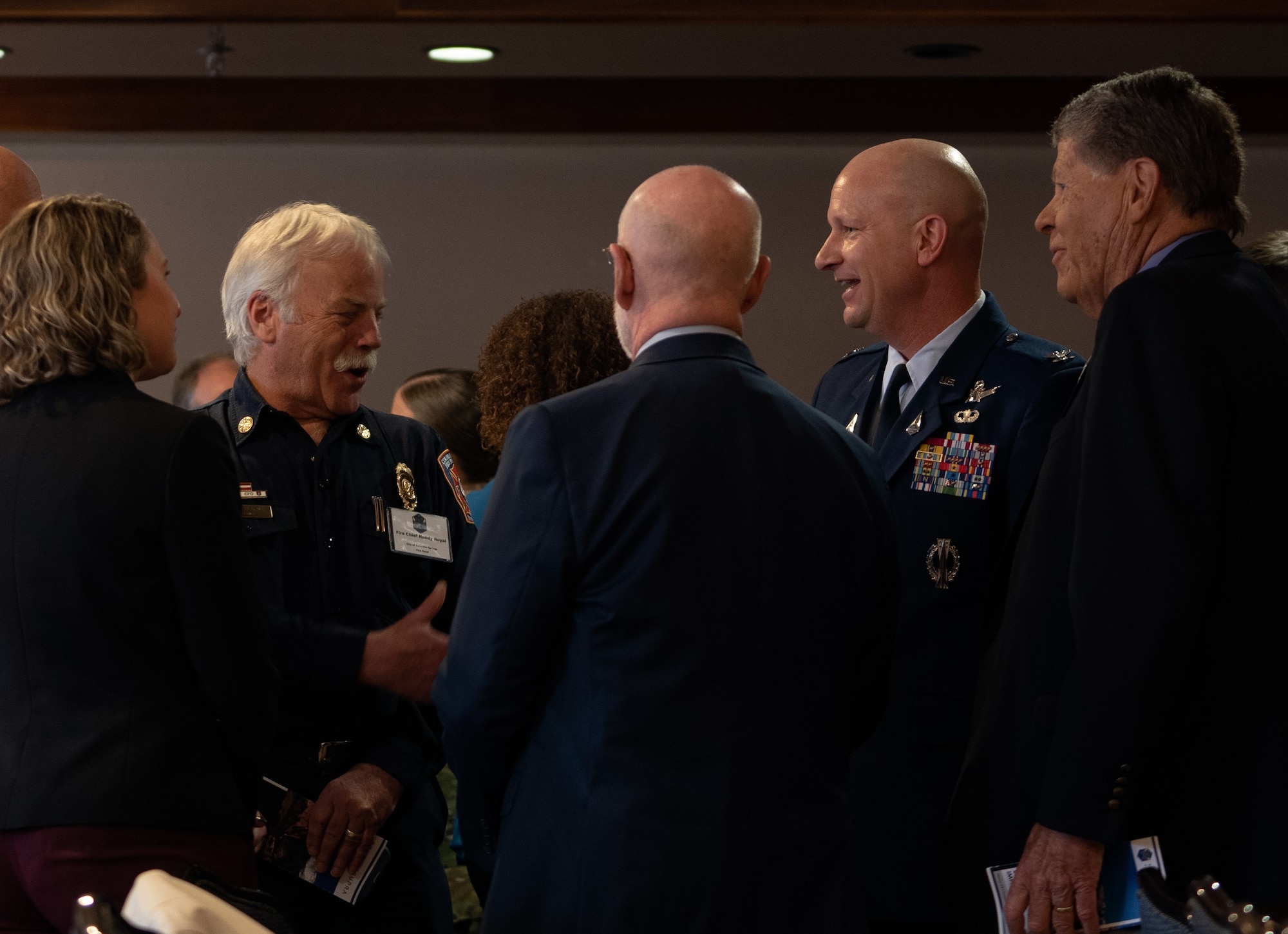 U.S. Space Force Col. David Hanson, Space Base Delta 1 commander, greets Mr. Randy Royal, City of Colorado Springs Fire Chief, before presenting the State of the Bases address at Peterson Space Force Base, Colorado, March 21, 2023. Due to the COVID-19 pandemic, the last State of the Bases address with in 2019. (U.S. Space Force photo by SrA. Jared Bunn)
