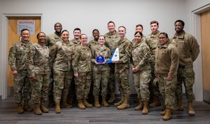 Airmen pose for a group photo.