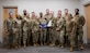 Airmen pose for a group photo.