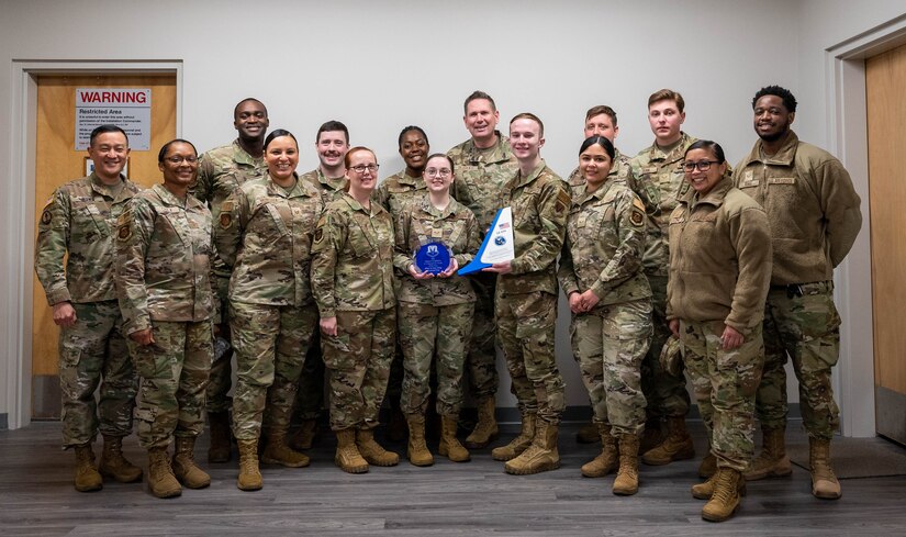 Airmen pose for a group photo.