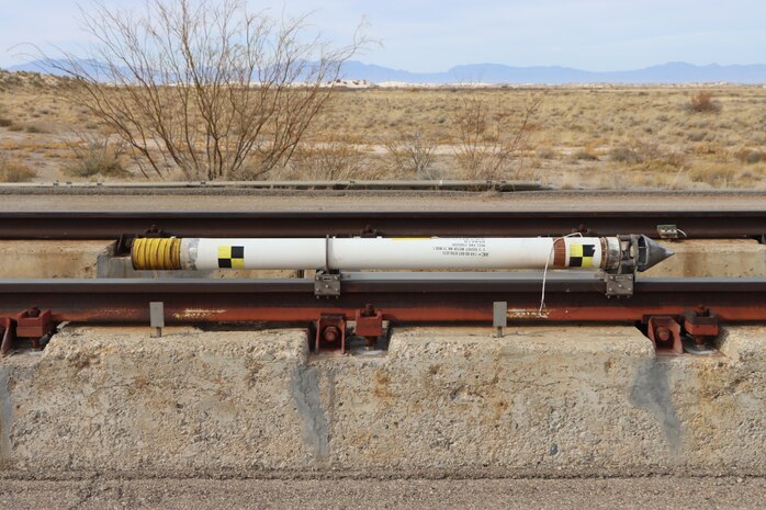 A newly designed birdchaser is readied for initial checkout testing Dec. 8, 2021, at the Arnold Engineering Development Complex High Speed Test Track at Holloman Air Force Base, N.M. Used to mitigate bird and animal strikes during High-Speed Test Track test missions, birdchaser sleds are fired 10 to 40 seconds before the mission sleds. (U.S. Air Force photo by Deidre Moon)