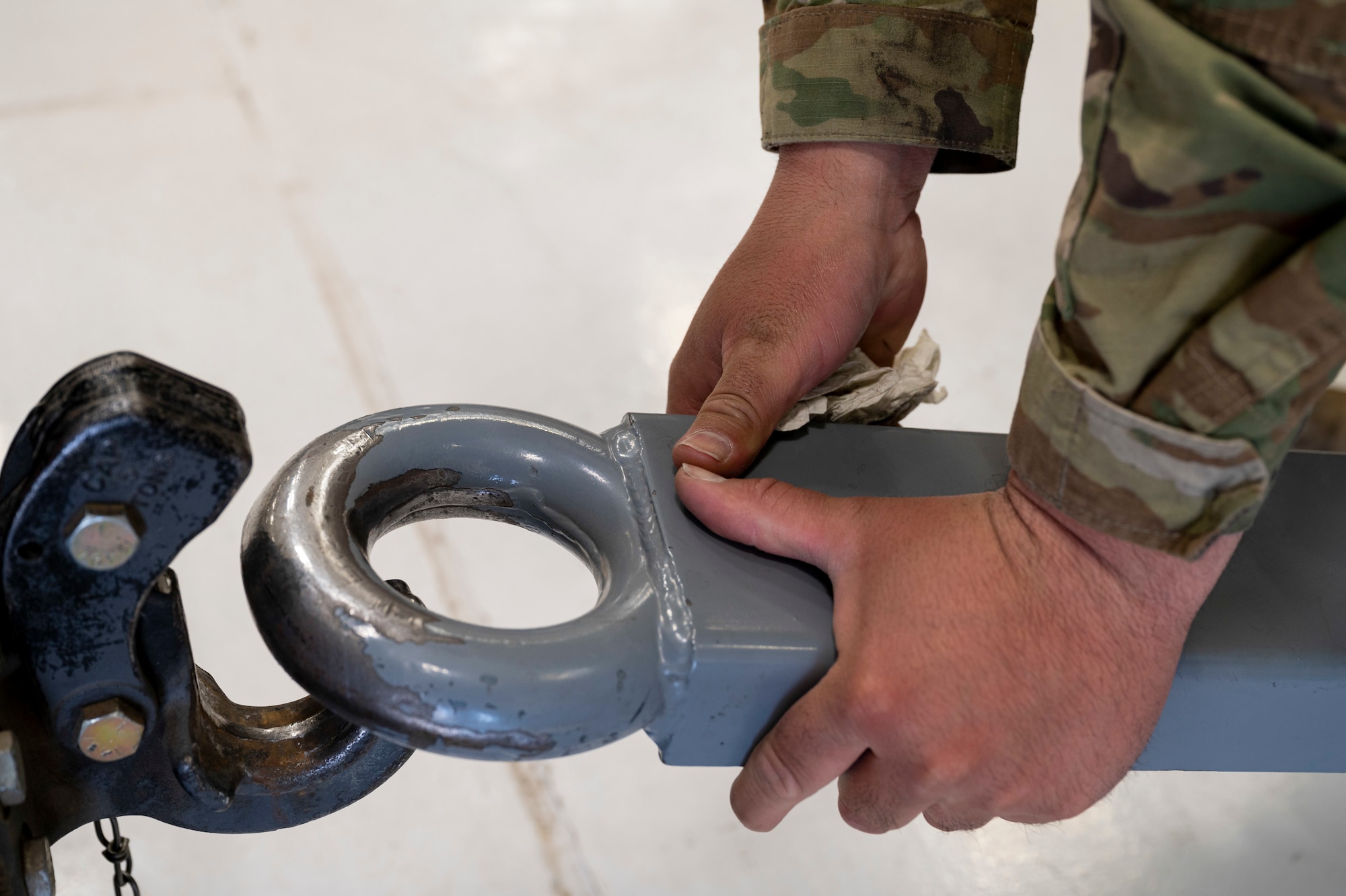 An Airmen from the 49th Equipment Maintenance Squadron aerospace ground equipment flight, attaches a hydraulic test stand to a tow hitch at Holloman Air Force Base, New Mexico, March 21, 2023.