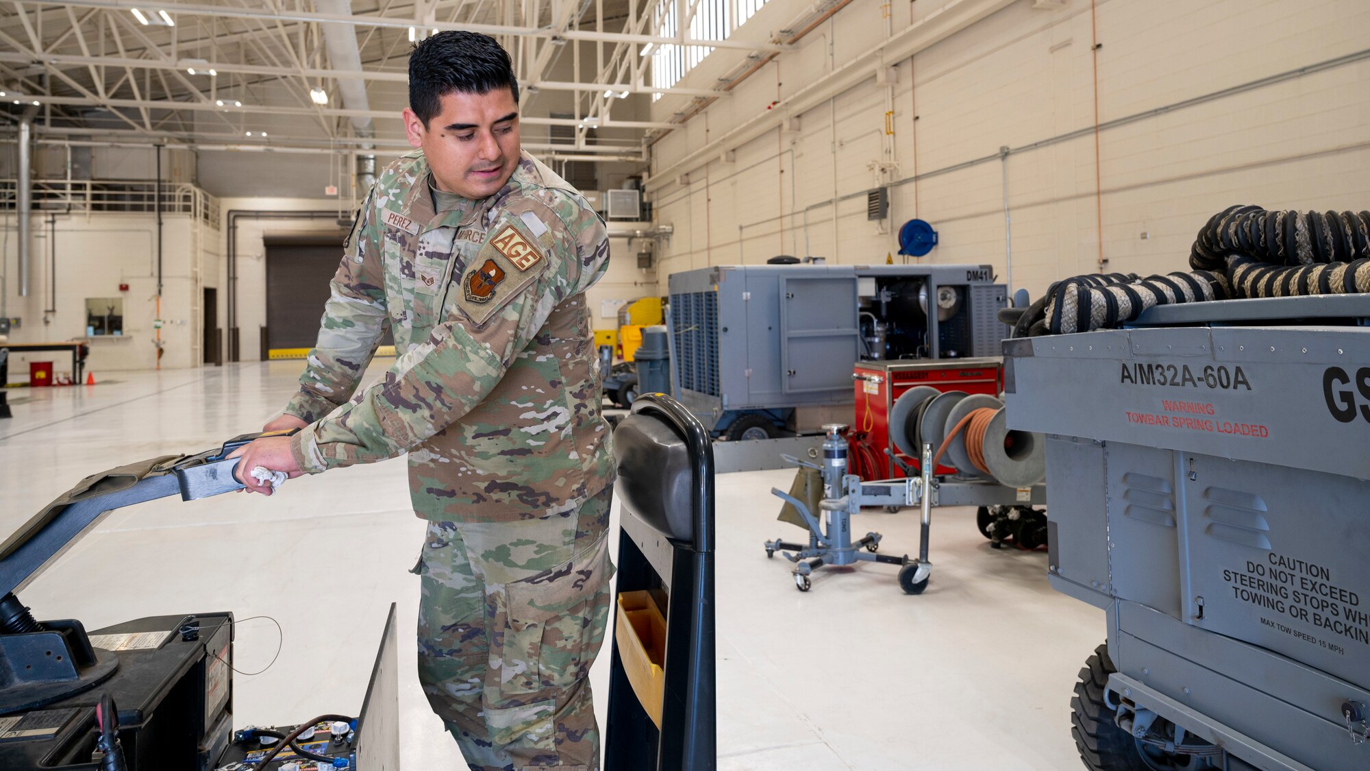 U.S. Air Force Staff Sgt. Andrei Perez, 49th Equipment Maintenance Squadron aerospace ground equipment maintenance floor lead, tows a hydraulic test stand at Holloman Air Force Base, New Mexico, March 21, 2023.