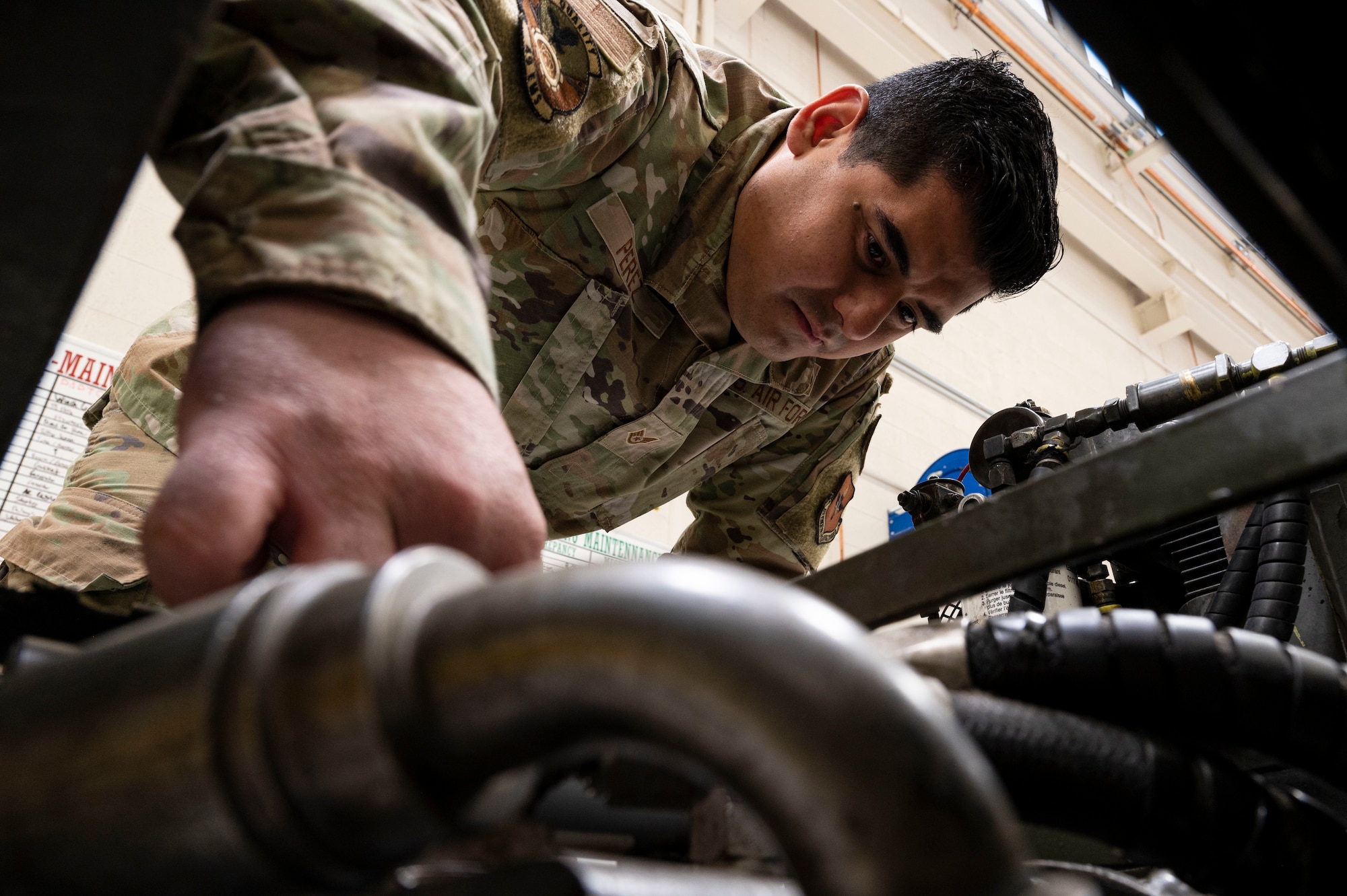 U.S. Air Force Andrei Perez, 49th Equipment Maintenance Squadron aerospace ground equipment maintenance floor lead, performs maintenance on a bomb lift at Holloman Air Force Base, New Mexico, March 21, 2032.