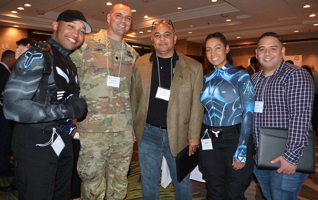 Lt. Col. Charlie Jones, contracting officer with the U.S. Army Corps of Engineers Los Angeles District, second from left, poses for a picture with, from left to right, Anthony Moore, Jones, Wayne Mackey, Catrina Moore and Raul Lopez, all with Mackey Training Advising Compliance, LLC, during the March 8 Business Opportunities Open House in Rosemead, California.