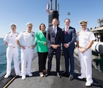 Australian Treasurer Jim Chalmers, center, poses for a photo onboard the Los Angeles-class fast-attack submarine USS Asheville (SSN 758) with WA Federal MPs Minister for Northern Australia and Resources Madeleine King, Minister for Defence Personnel and Veterans' Affairs Matt Keogh, Royal Australian Navy Rear Adm. Matt Buckley, Head of Capability, Nuclear Powered Submarine Task Force, right, Rear Adm. Rick Seif, commander, Submarine Group 7, second from left, and Cmdr. Tom Dixon, Asheville’s commanding officer following a tour, March 14. Asheville conducted multiple tours for distinguished visitors during a routine port visit to HMAS Stirling, Western Australia to enhance interoperability and communication, and strengthen relationships with the Royal Australian Navy.