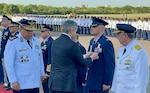 Mario Abdo Benitez, President of Paraguay, pins Col. José Jiménez, Jr., Commandant of the  Inter-American Air Forces Academy, with the Medal of Honor for the Centennial Commemoration of the Paraguayan Air Force in Asunción, Paraguay, Feb. 22, 2023. Benitez greeted senior members of visiting delegations and pinned each of them with the medal of honor to commemorate the anniversary. (Courtesy Photo)