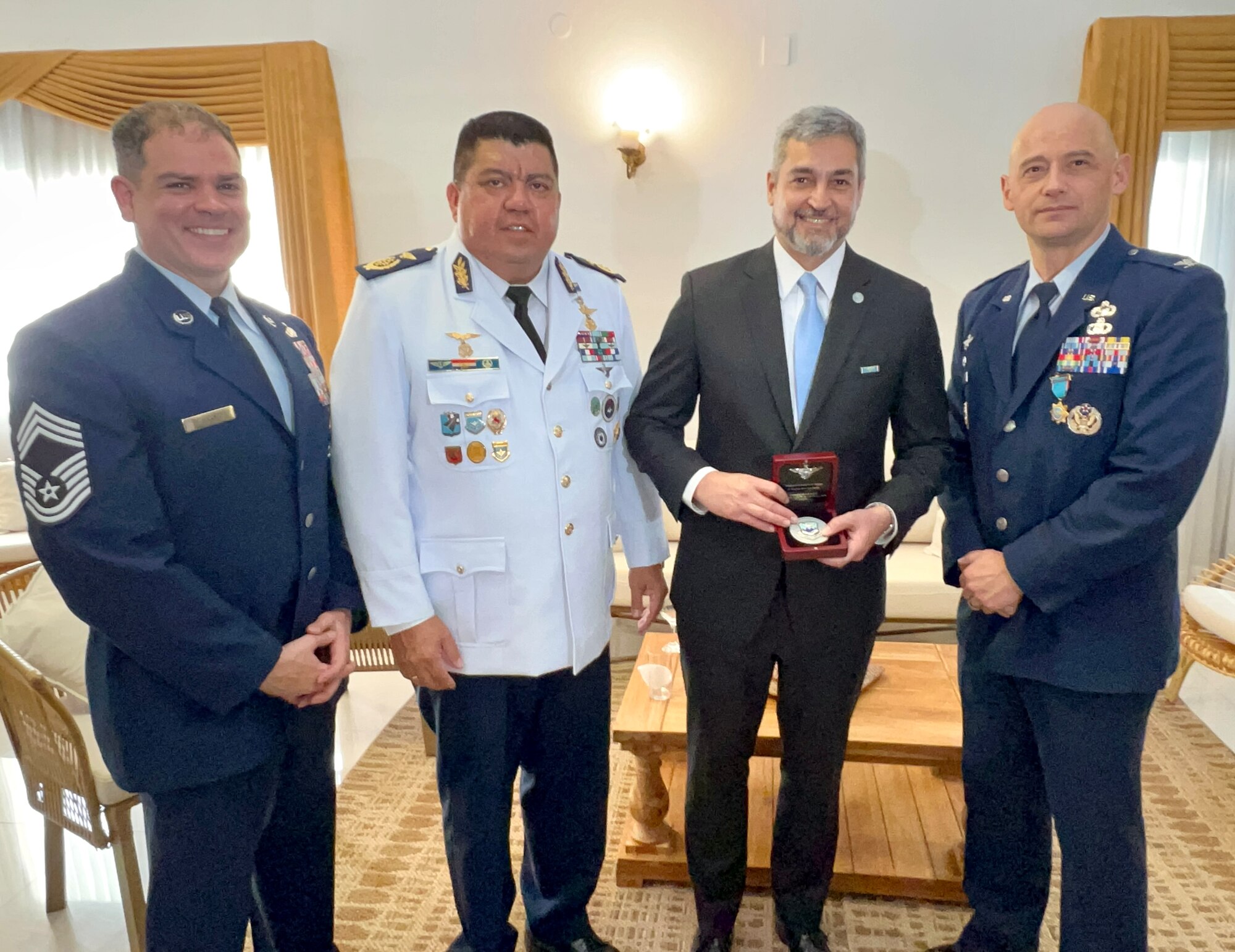 Mario Abdo Benitez, President of Paraguay, holds a token from the Inter-American Air Forces Academy. President Benitez is flanked by Chief Master Sgt. Yusef Saad, IAAFA Senior Enlisted Leader, Gen. Arturo González Ocampo, Commander of the Paraguayan Air Force, and Col. José Jiménez, Jr., IAAFA commandant, in Asunción, Paraguay, Feb. 22, 2023. The senior leaders attended the Paraguayan Air Force’s Centennial Anniversary in Asunción, Paraguay. (Courtesy photo)
