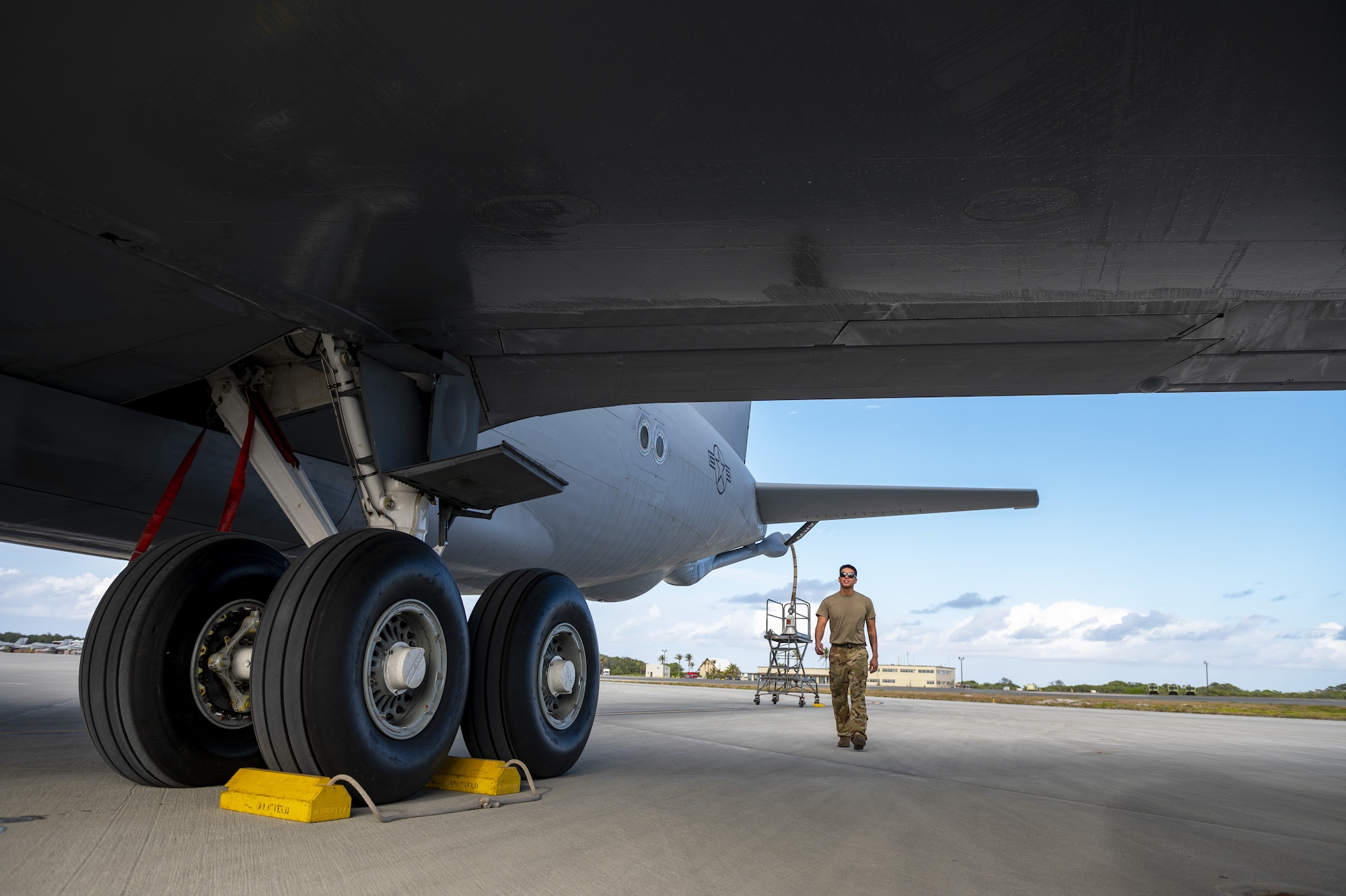 U.S. Air Force Tech. Sgt. Max Ramos, 92nd Aircraft Maintenance Squadron flying crew chief, performs a post-flight inspection following an air refueling coronet mission with U.S. Marine Corps F/A-18C Hornets, March 9, 2023. Aircrew from the 384th Air Refueling Squadron conducted an air refueling coronet with Marines from the Marine Fighter Attack Squadron 312, demonstrating the critical role mobility forces have in projecting the joint force anywhere, anytime. (U.S. Air Force photo by Staff Sgt. Lawrence Sena)